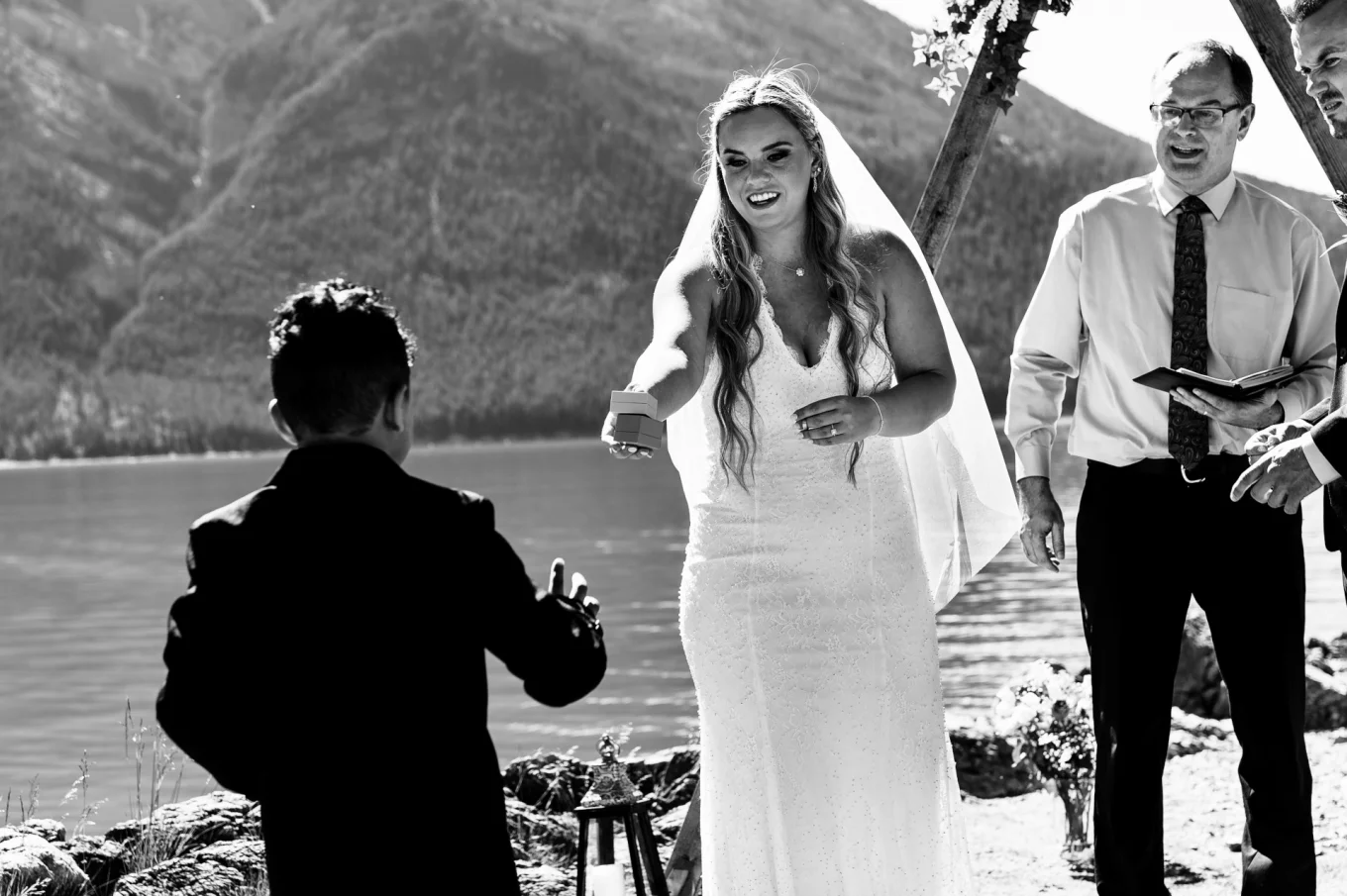 Ring boy provide the wedding rings during the elopement at Minnewanka Lake