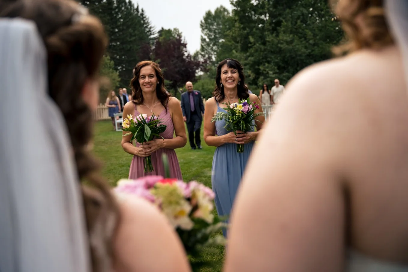 Wedding guests approach the brides to congratulate after elopement in Calgary.