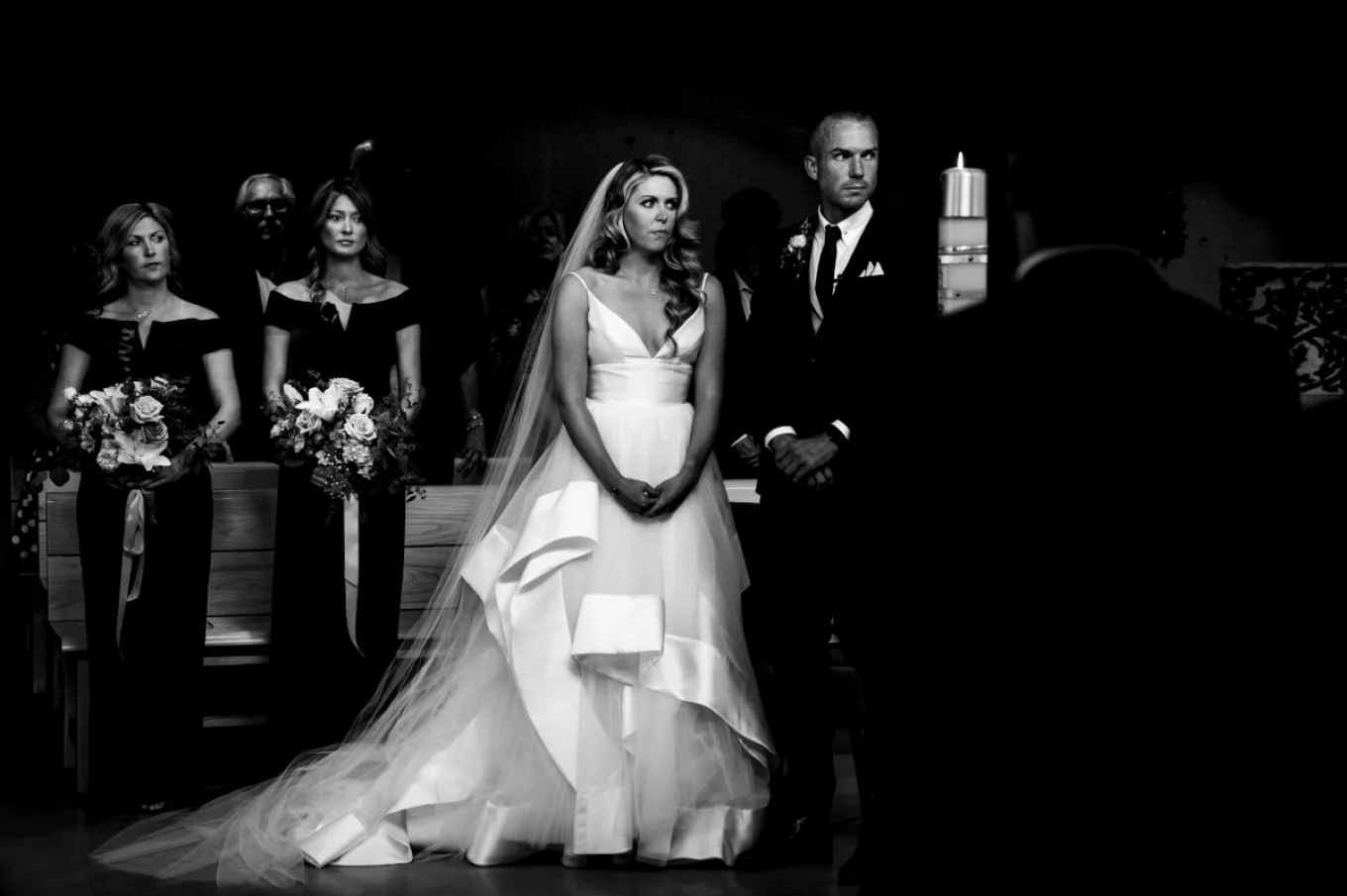 Bride and Groom praying in the church during their Calgary Wedding Ceremony