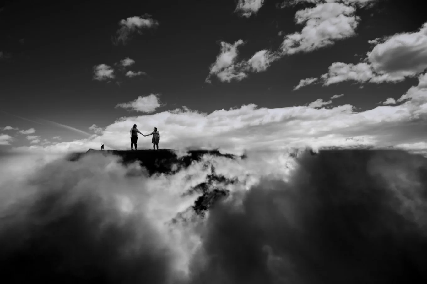 Creative Banff Engagement Photography. The couple in the clouds