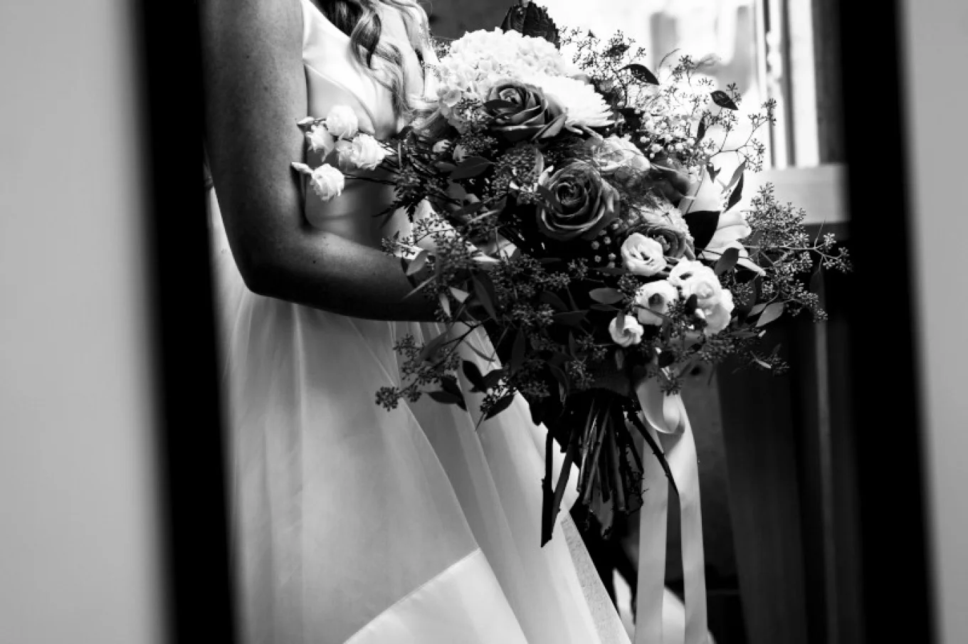 The bride 's looking at the mirror before her Calgary Wedding