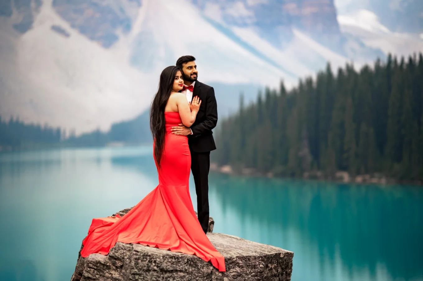 freshly engaged couple hugging each other at Moraine Lake. Banff Engagement Photogaphy.