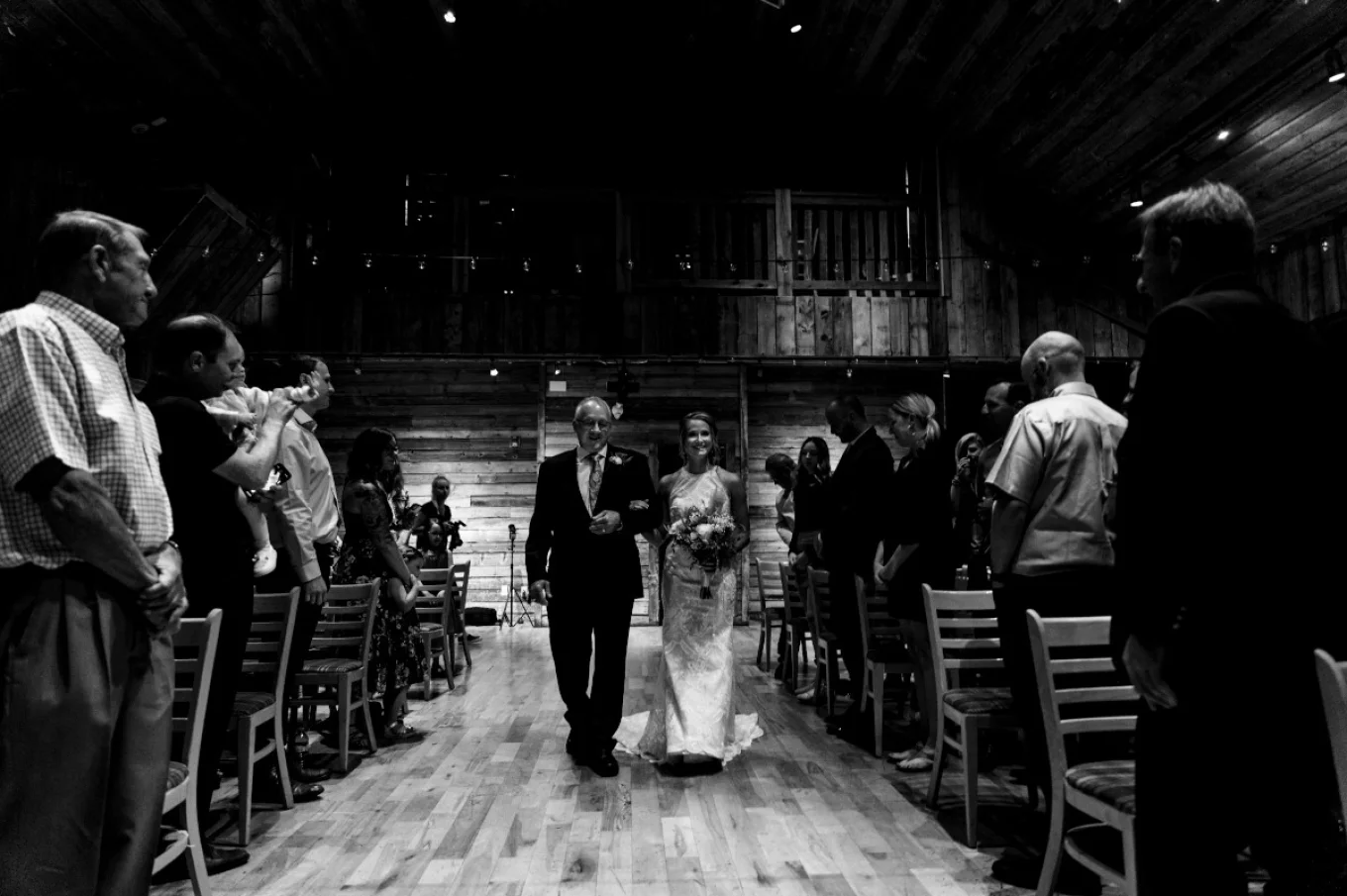 Father with the bride walking down the aisle