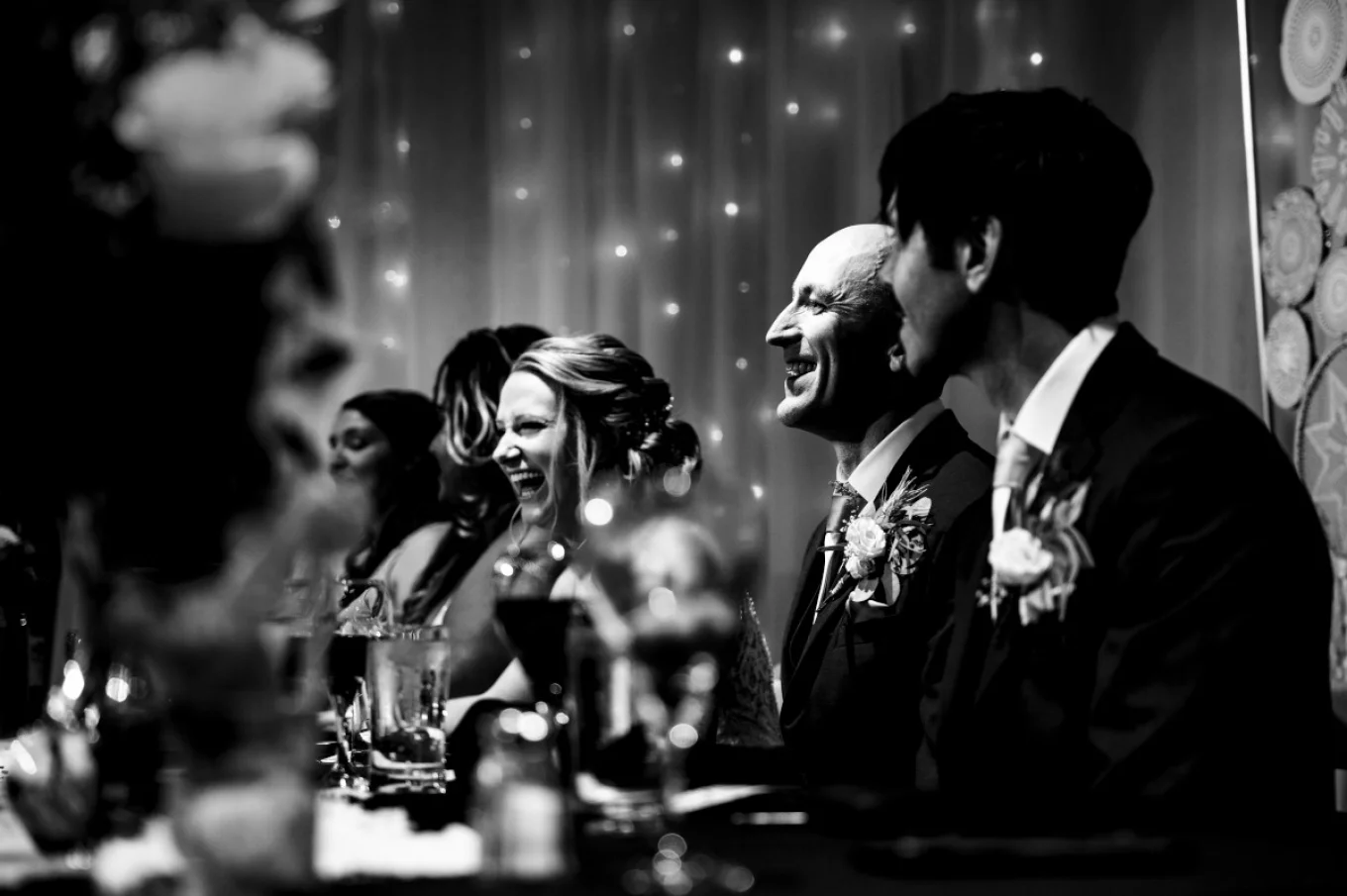 wedding reception. Bride and quests are laughing
