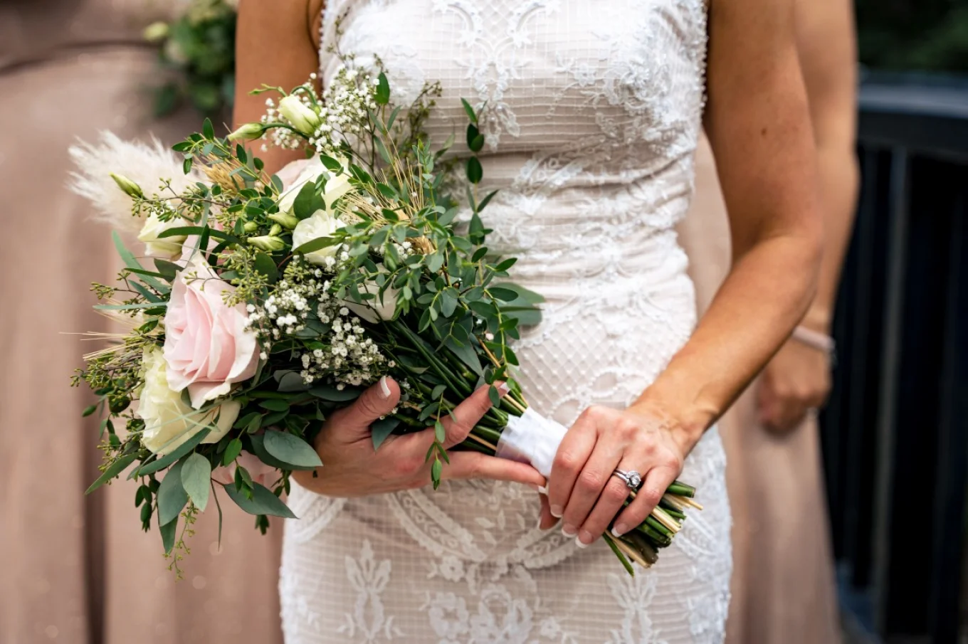 bride is holding a bouquet