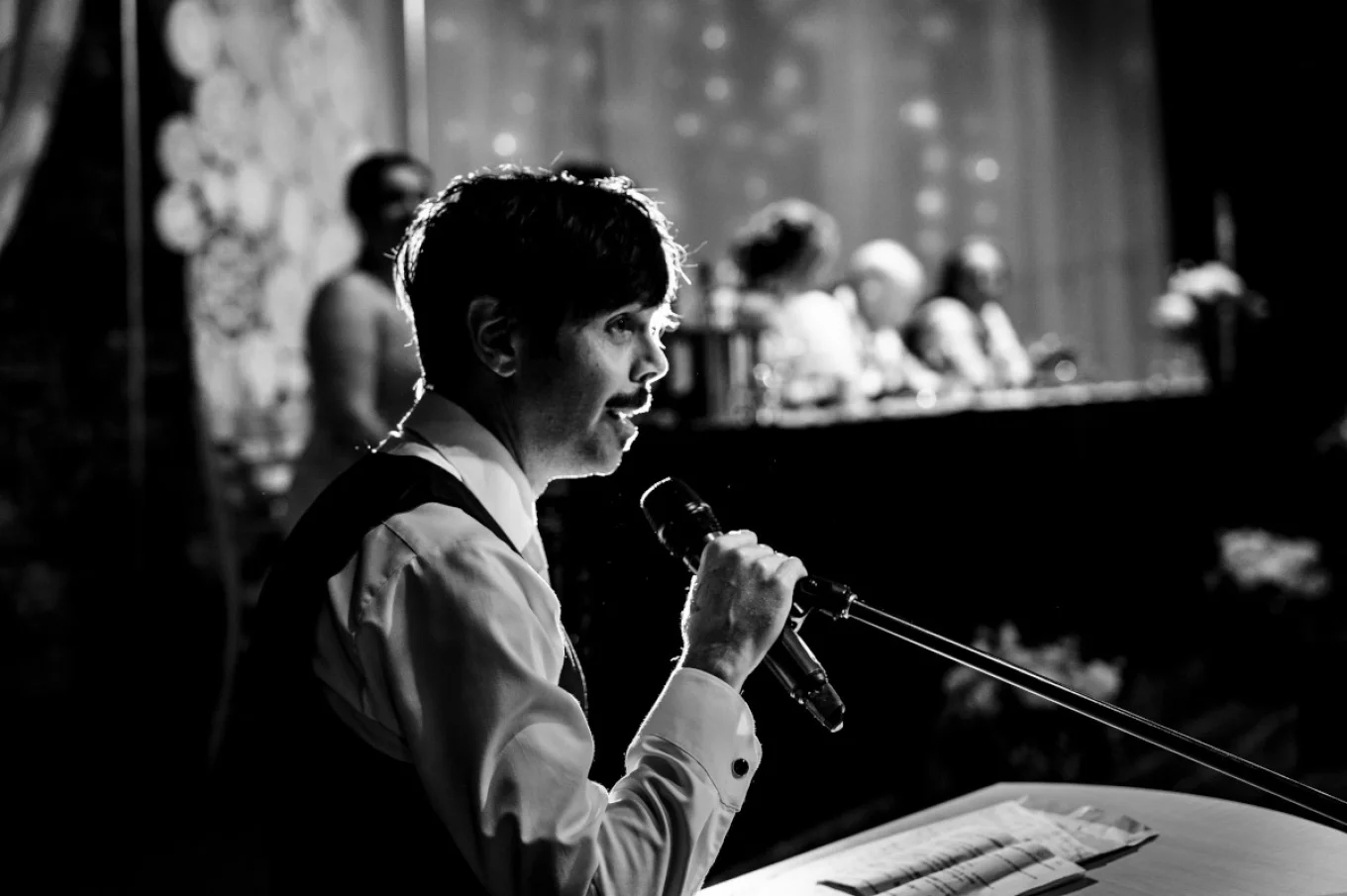 Best man is giving a speech captured by Calgary Wedding Photography