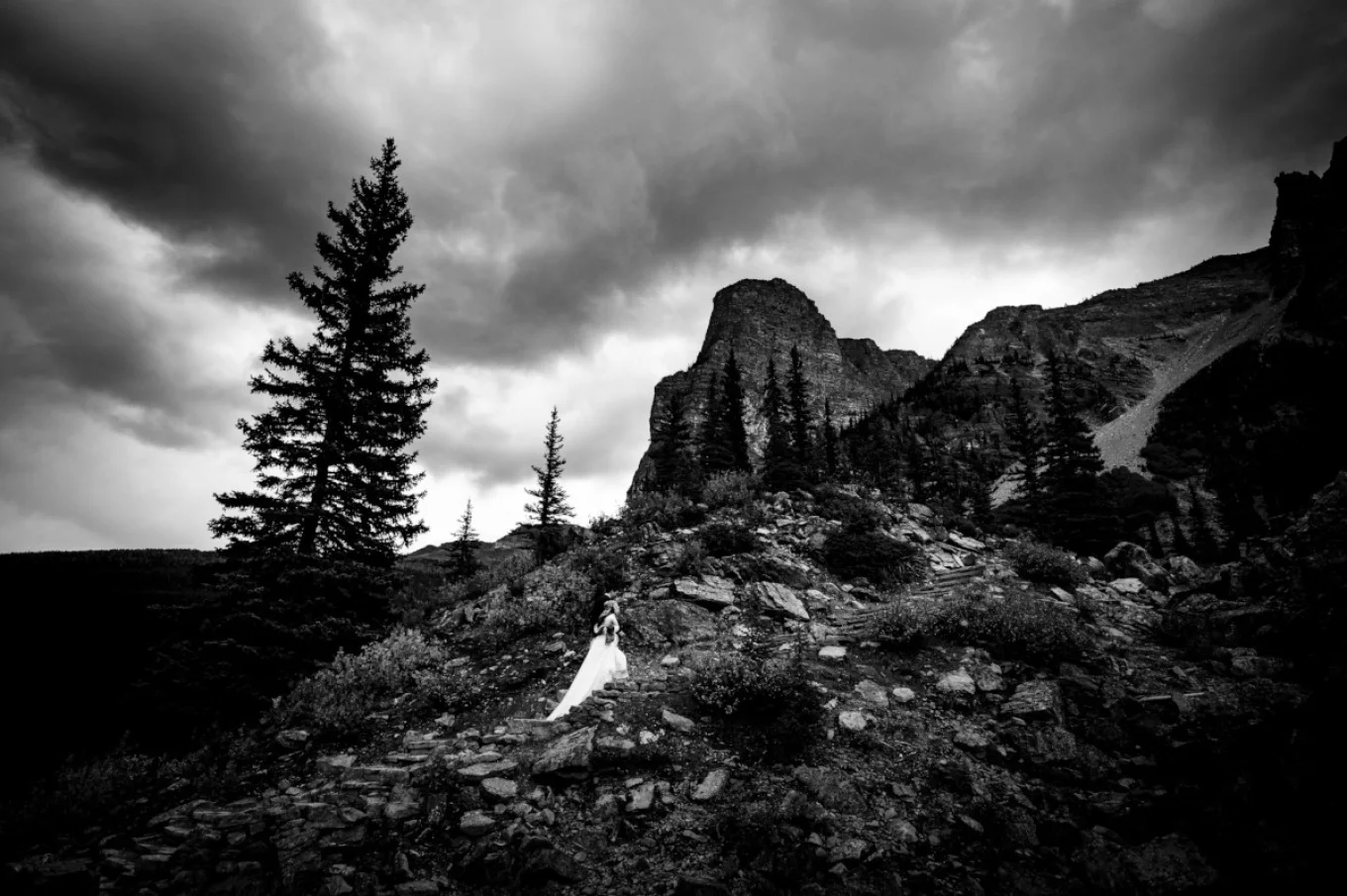 bride climbs the mountain in Banff National Park.