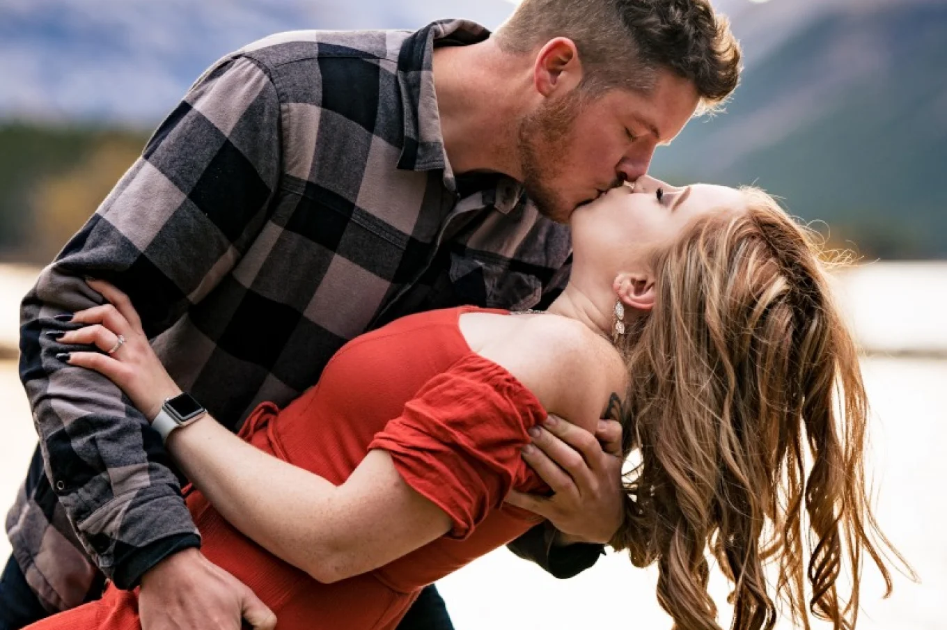 Man kisses his fiancee