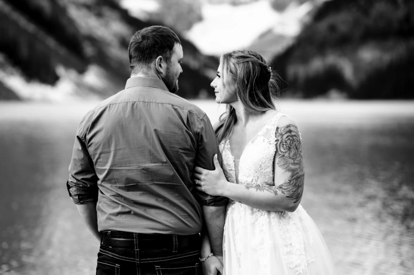 Groom and bride glance at each other.