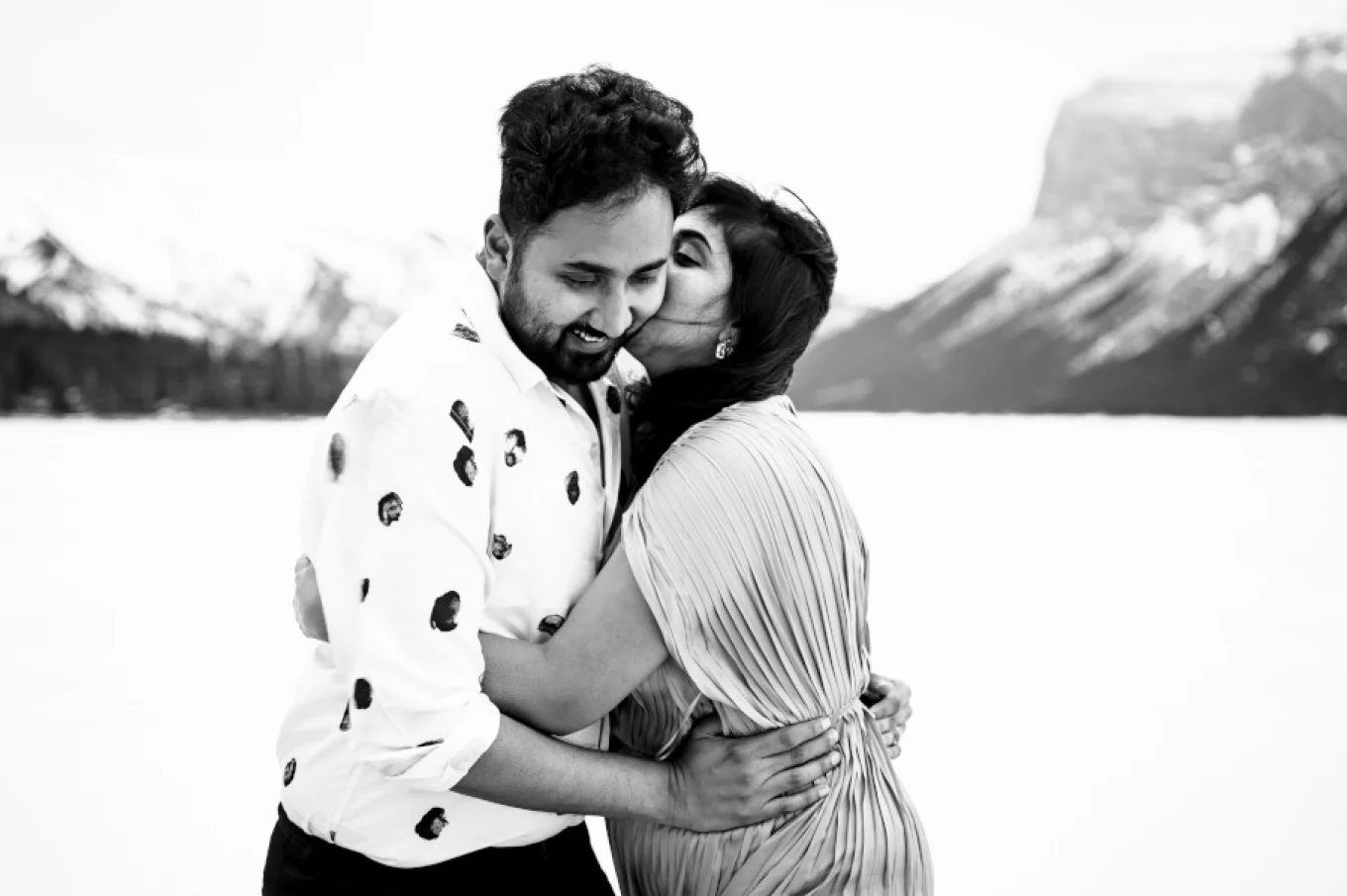 Indian girl whispers a secret to her husband ear.