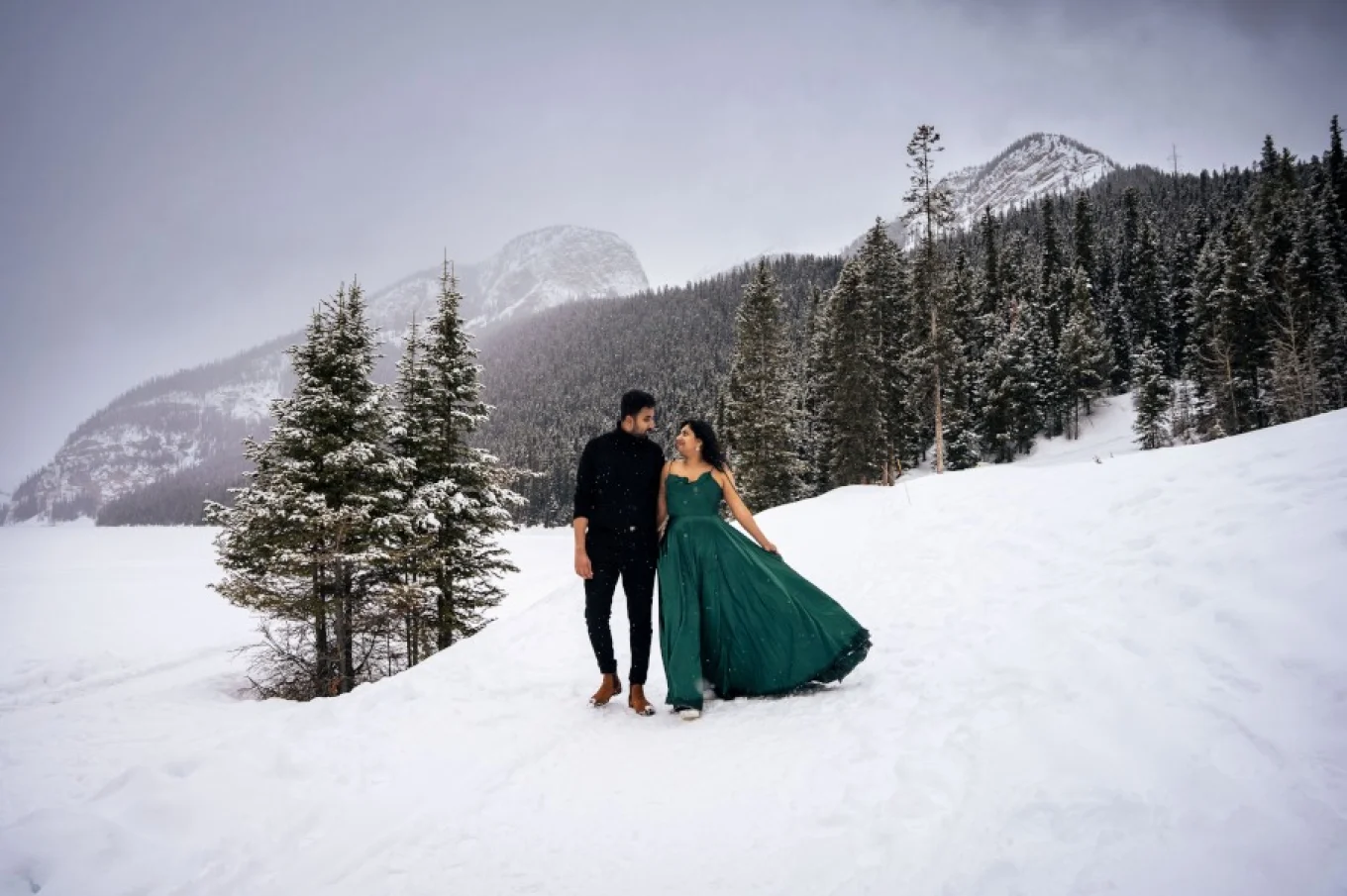 Indian couple walk in the mountains during wnter.