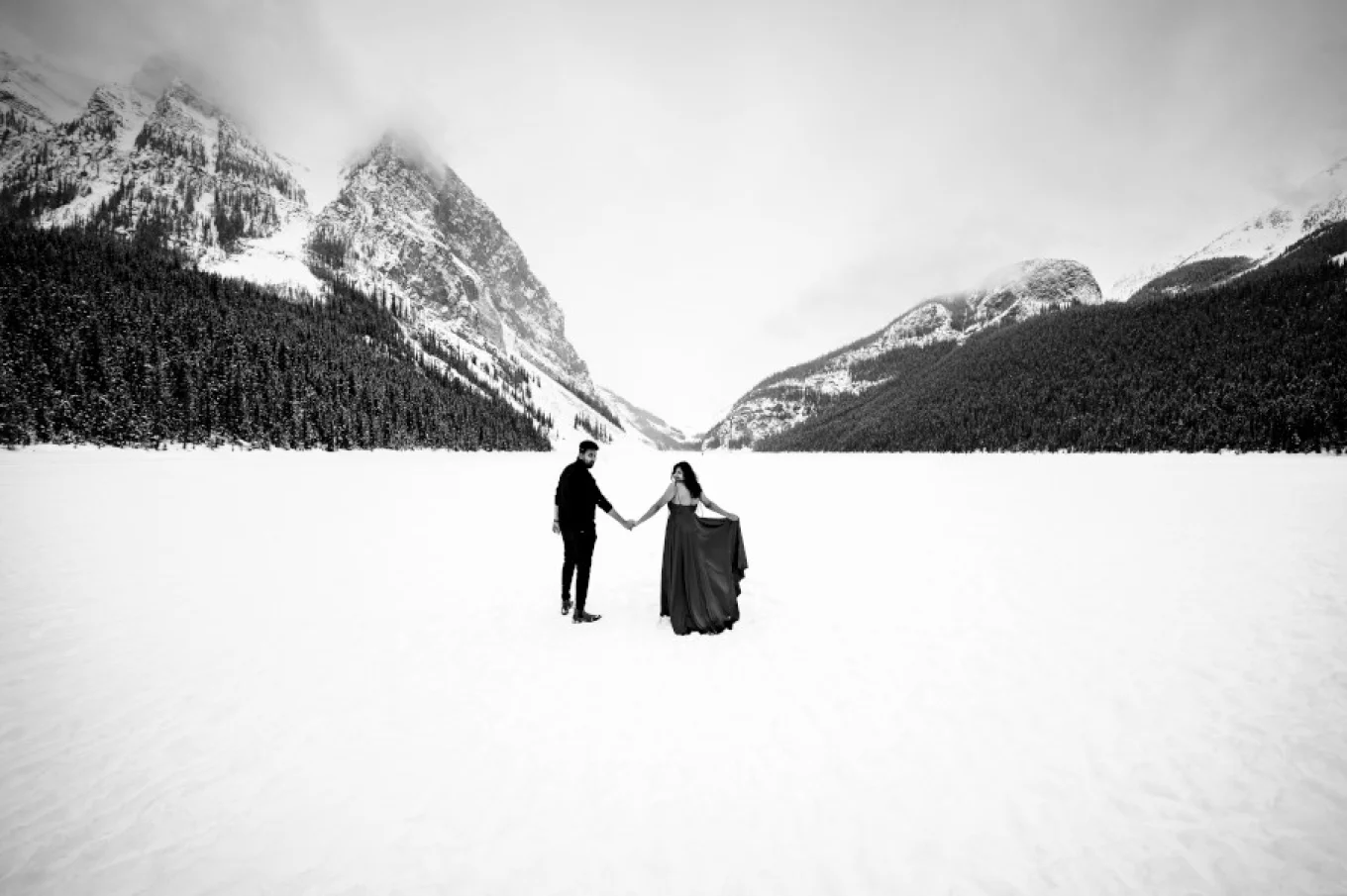 Gorgeous engagement photo session at Lake Louise in Banff during winter.