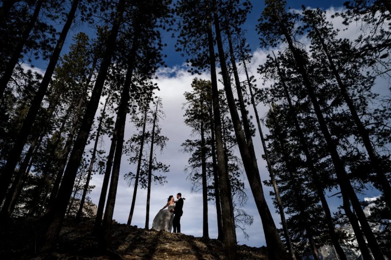 Bride and groom look deeply into each others eyes in the middle of nowhere