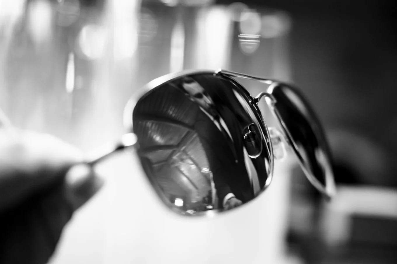 Groom's reflection in the sunglasses