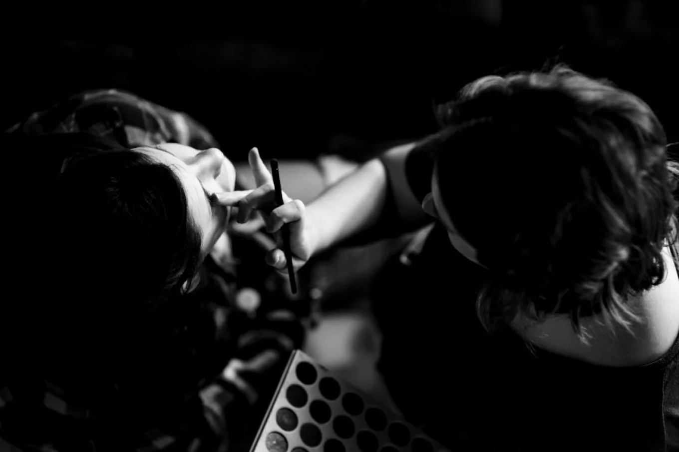 Make-up artist working on the bride's make up.