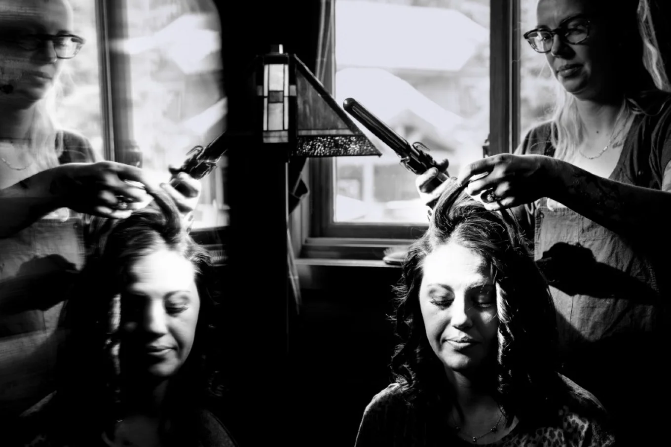 hairstylist work on bridesmaid hair