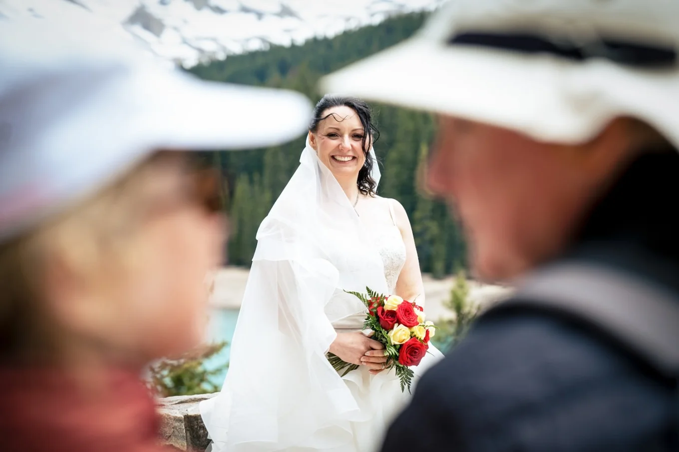 bride captured by shoot through the tourists at Moraine Lake