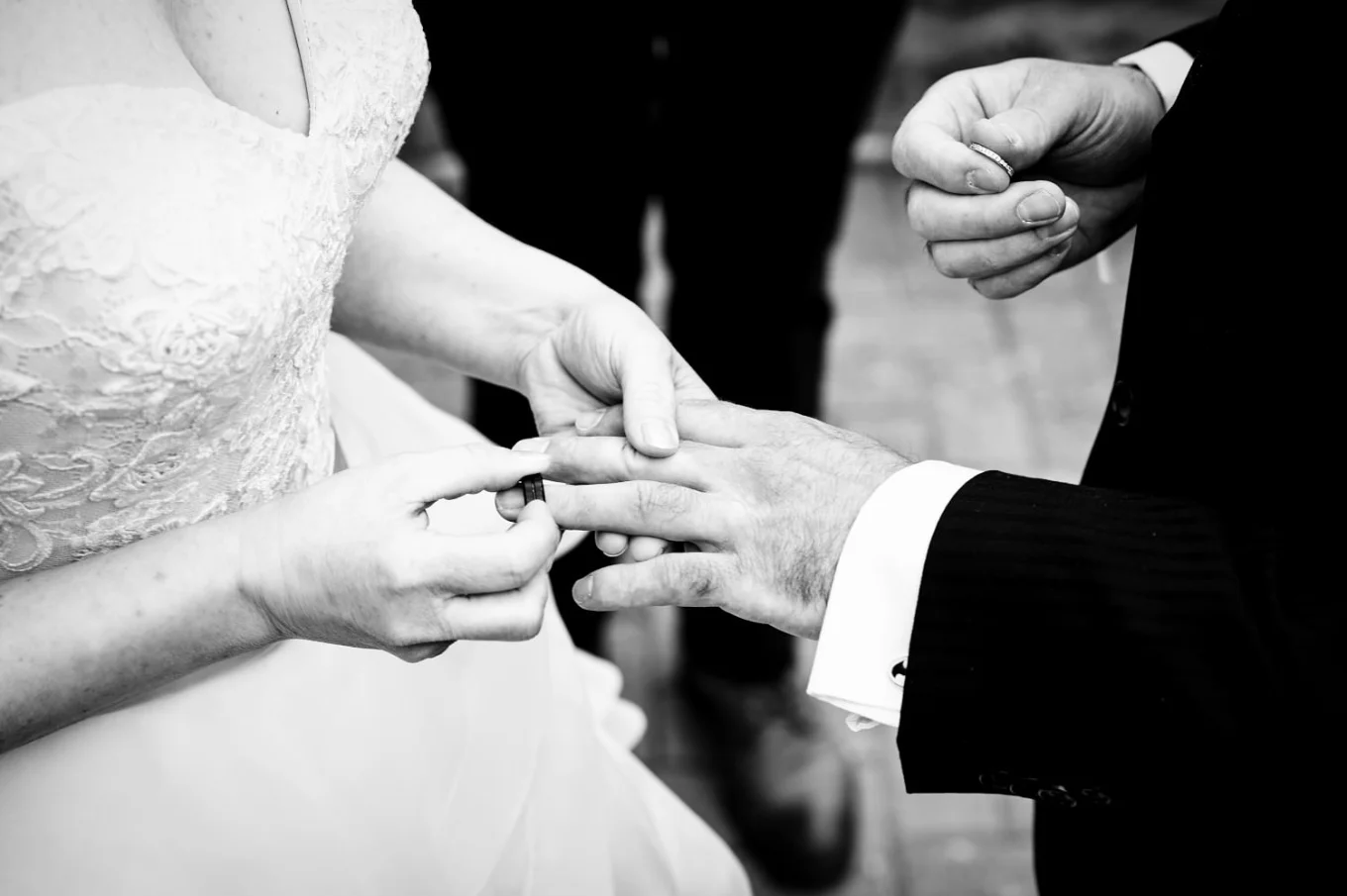 Wedding ring exchange in black and white
