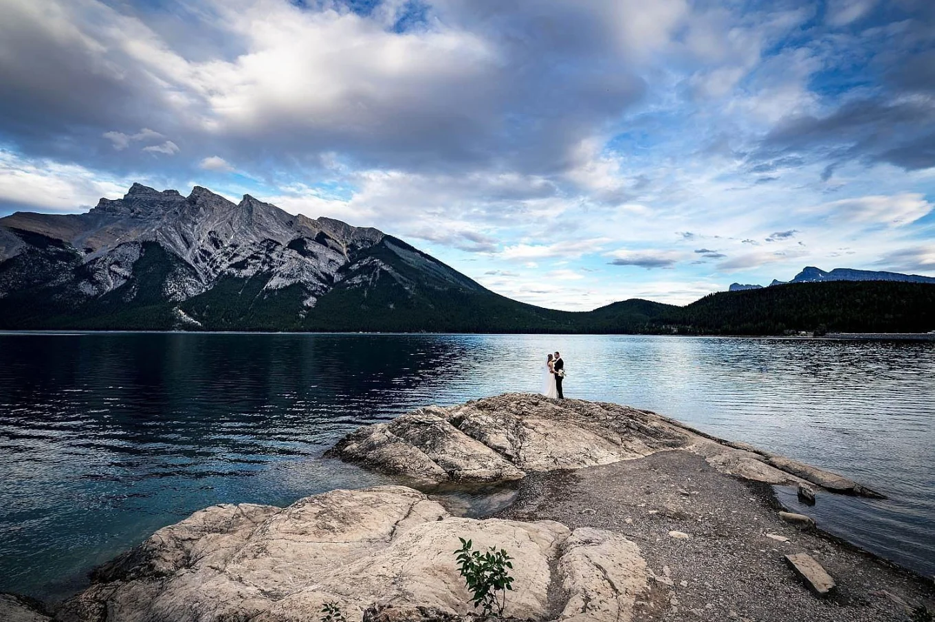 Newlyweds in a big environmental shoot at Minnewanka Lake in Banff.