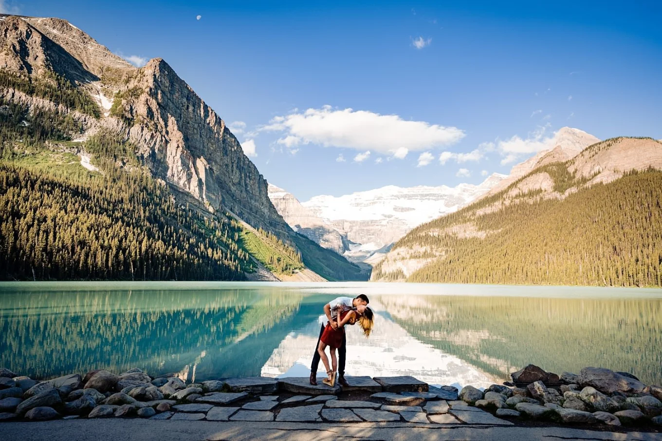 Banff Wedding Photography by the Lake Louise of couple kissing in stunning scenery.