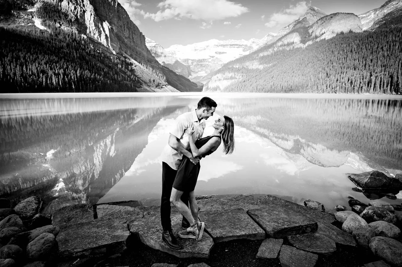Engaged Photography of dancing couple by Lake Louise.