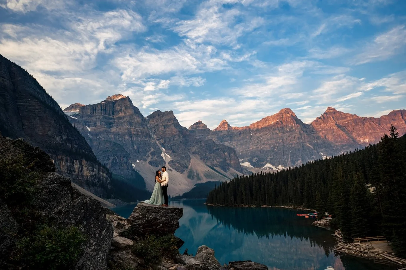 Per-wedding session of a coupe in love staying in a hug by amazing Moraine Lake in Banff.