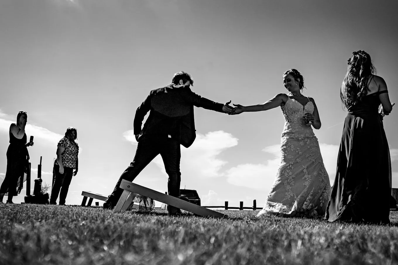 Bride and groom playing games and bet who will be the winner. Calgary Wedding.