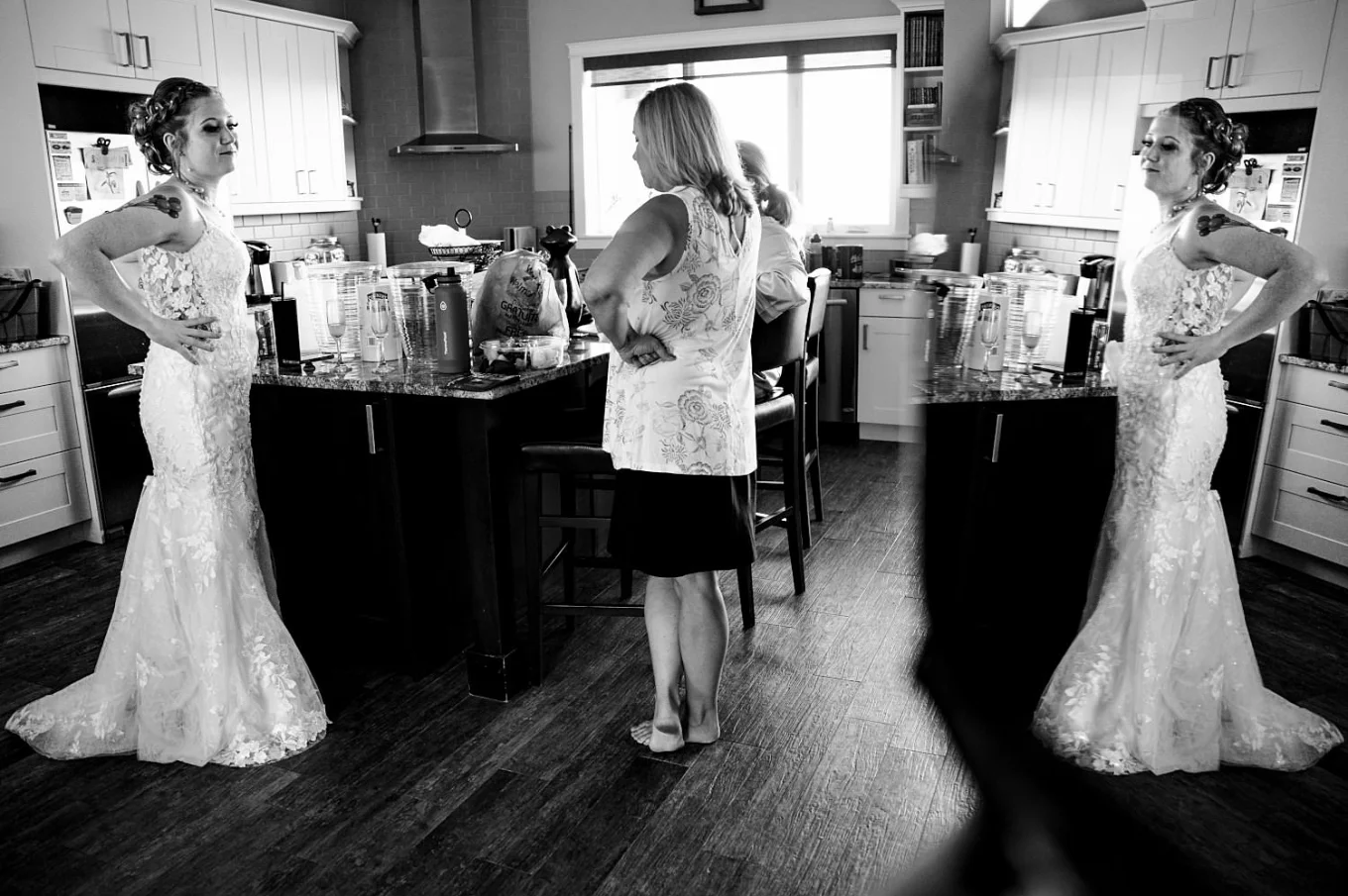 Photograph of the bride and her mother talking before the wedding ceremony in Calgary.