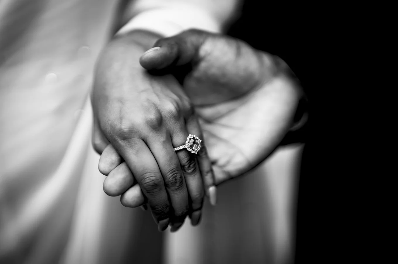 giant engagement ring on the finger.