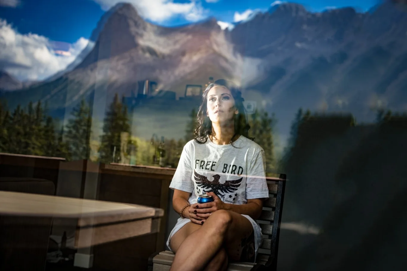 Photo through the window of the bride to be. In the window amazing reflection of the Canadian Rocky Mountains