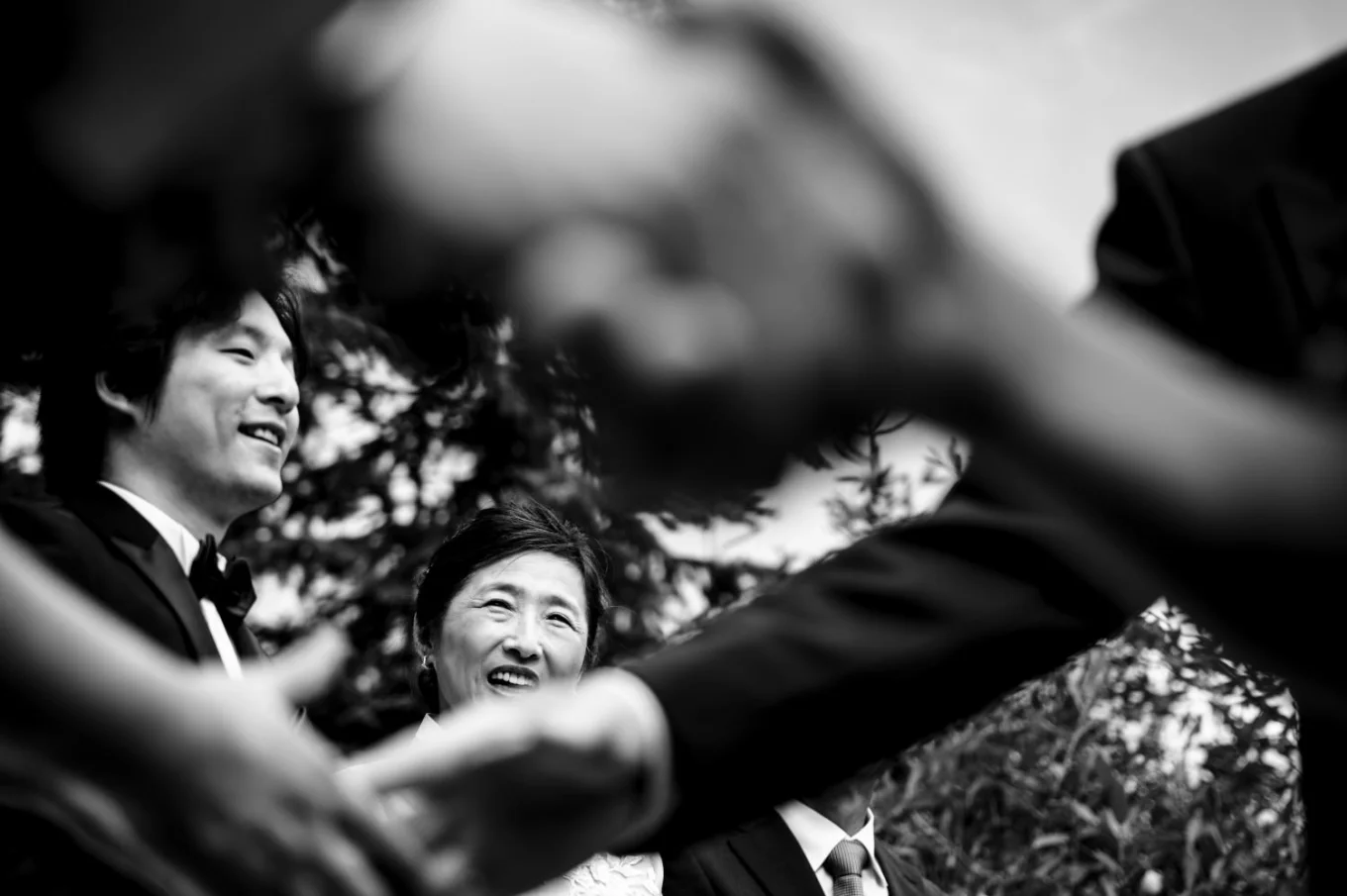 shoot through shaking hands or groom's Mather.