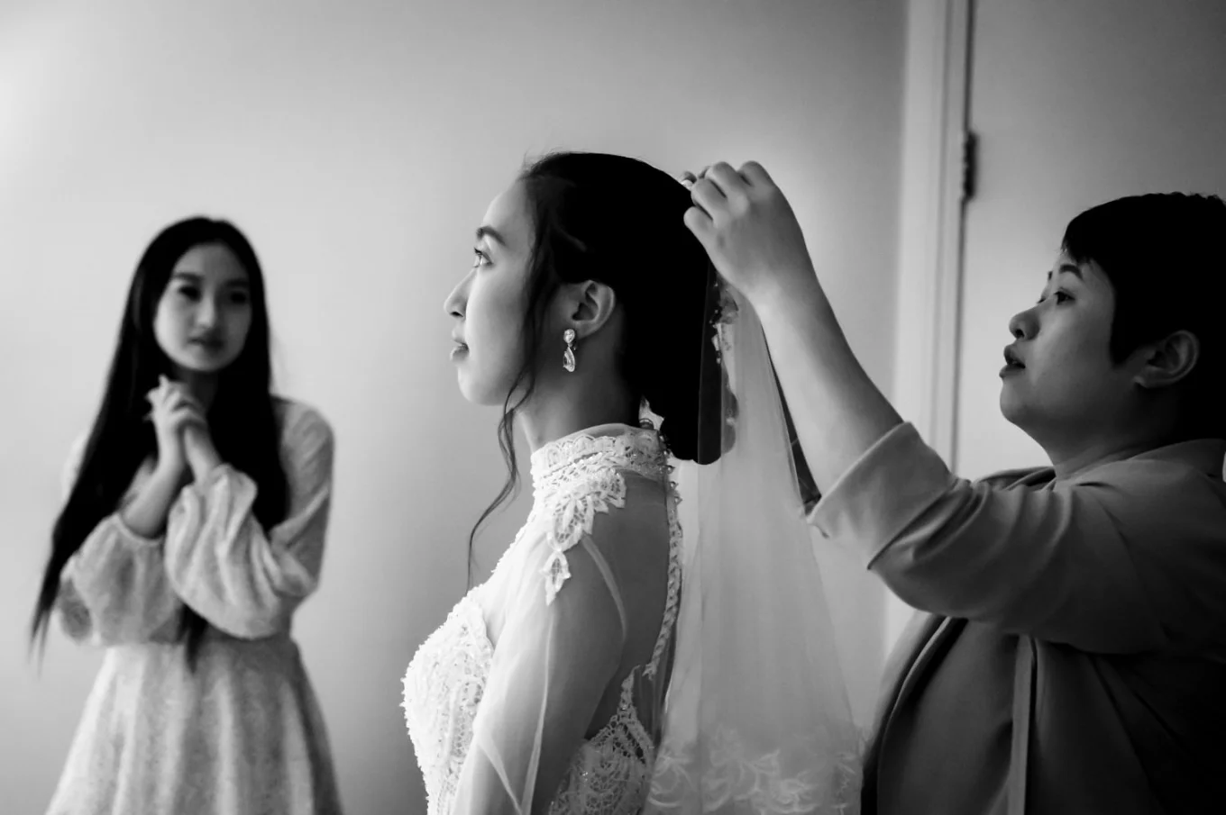 Mother of the bride help whit the veil before wedding ceremony at Elerald Lake in British Columbia.