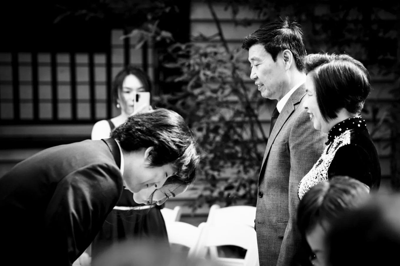 Newlyweds bowed to their parents after Banff Wedding Ceremony.