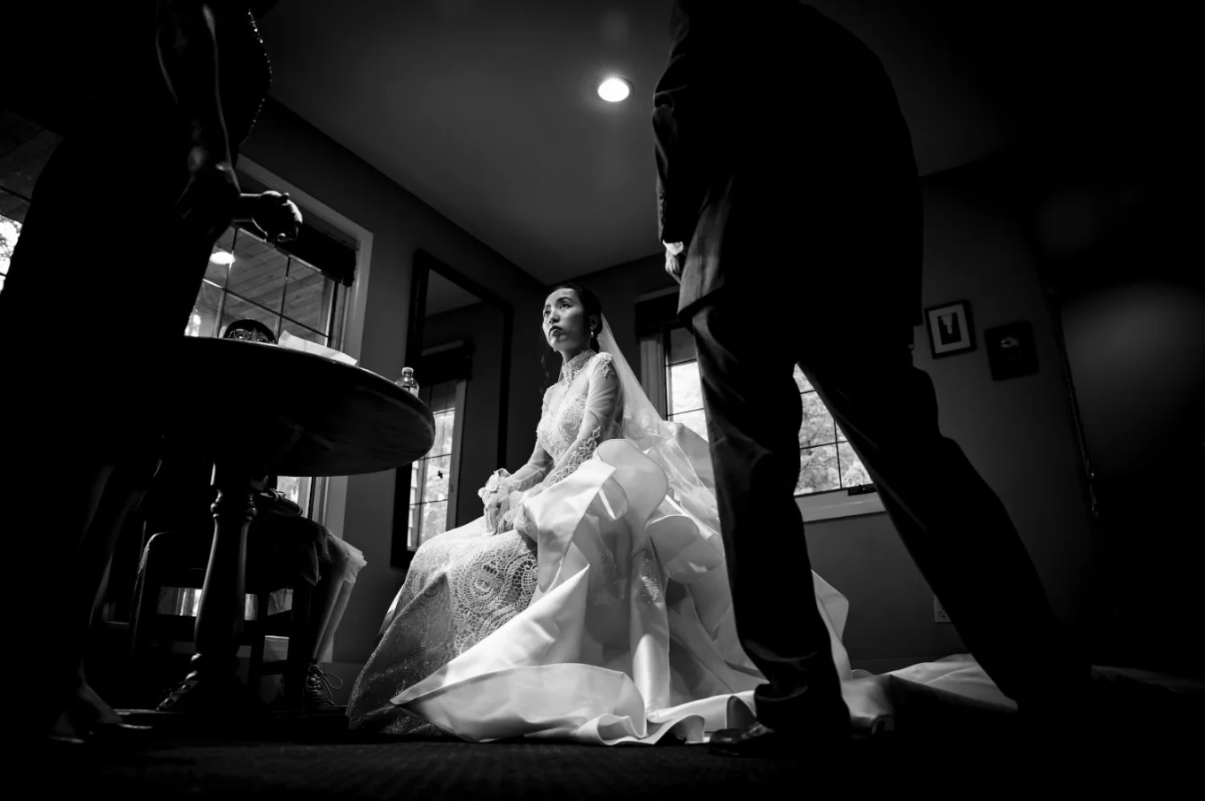 Bride sits at the chair while waiting to leave to participate in the wedding ceremony at Emerald Lake.