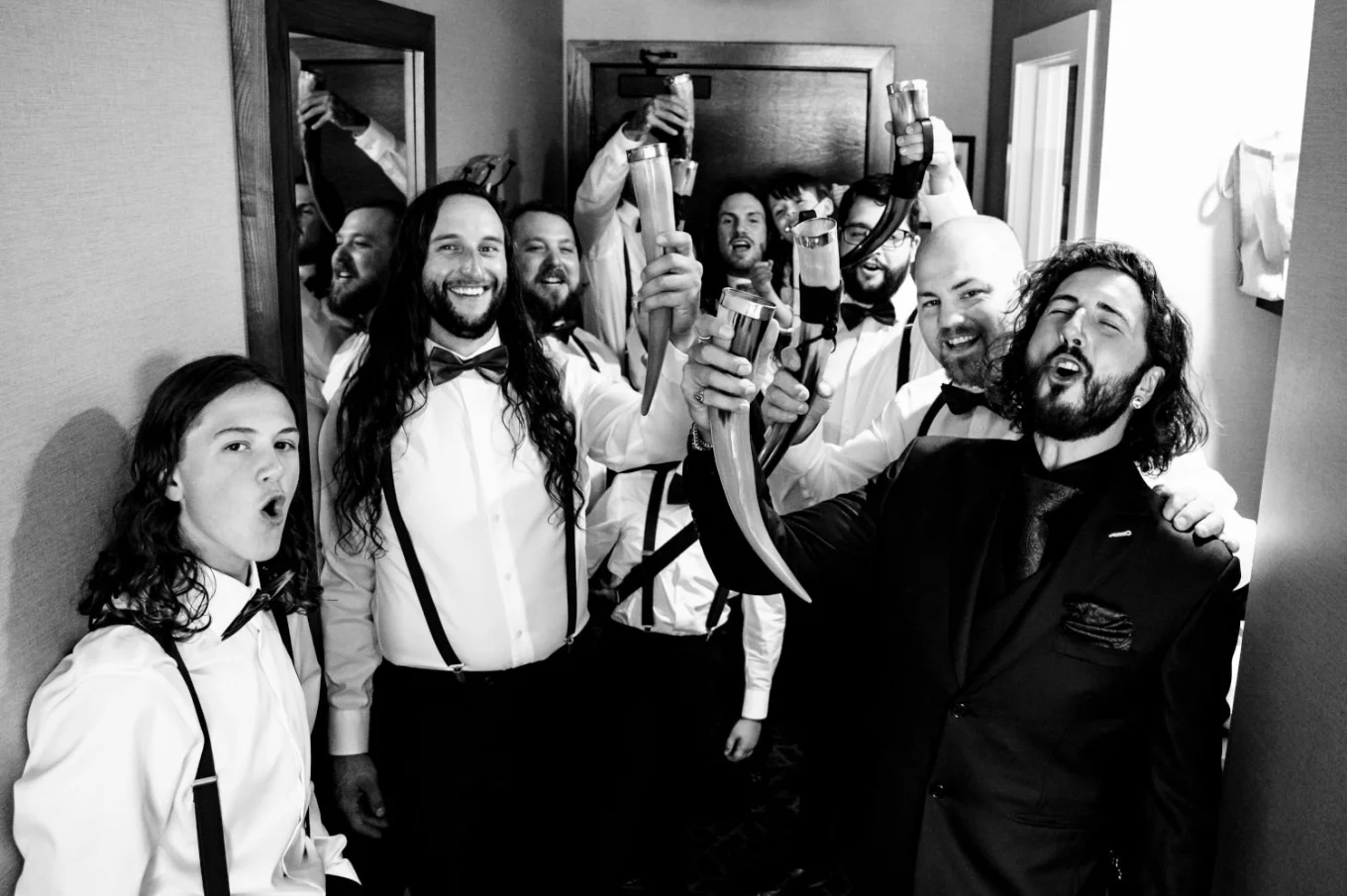 broom and his friends make a toast in the hotel room before Banff Wedding Ceremony.