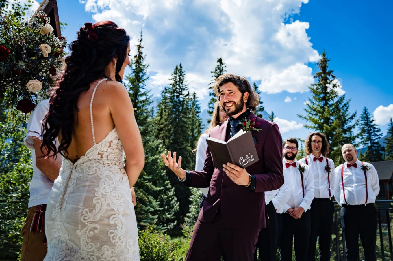 Groom gives a speech from his book at Banff Wedding Ceremony.