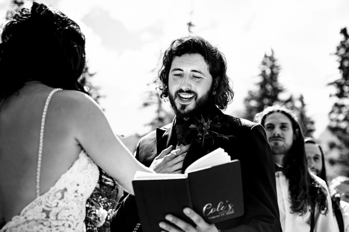 Wedding Photograph in black and white of the groom giving speech dyring Banff Wedding Ceremony.