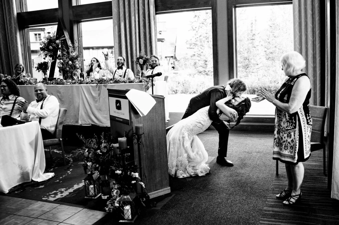 groom surprised the bride with passionate kiss during their speeches
