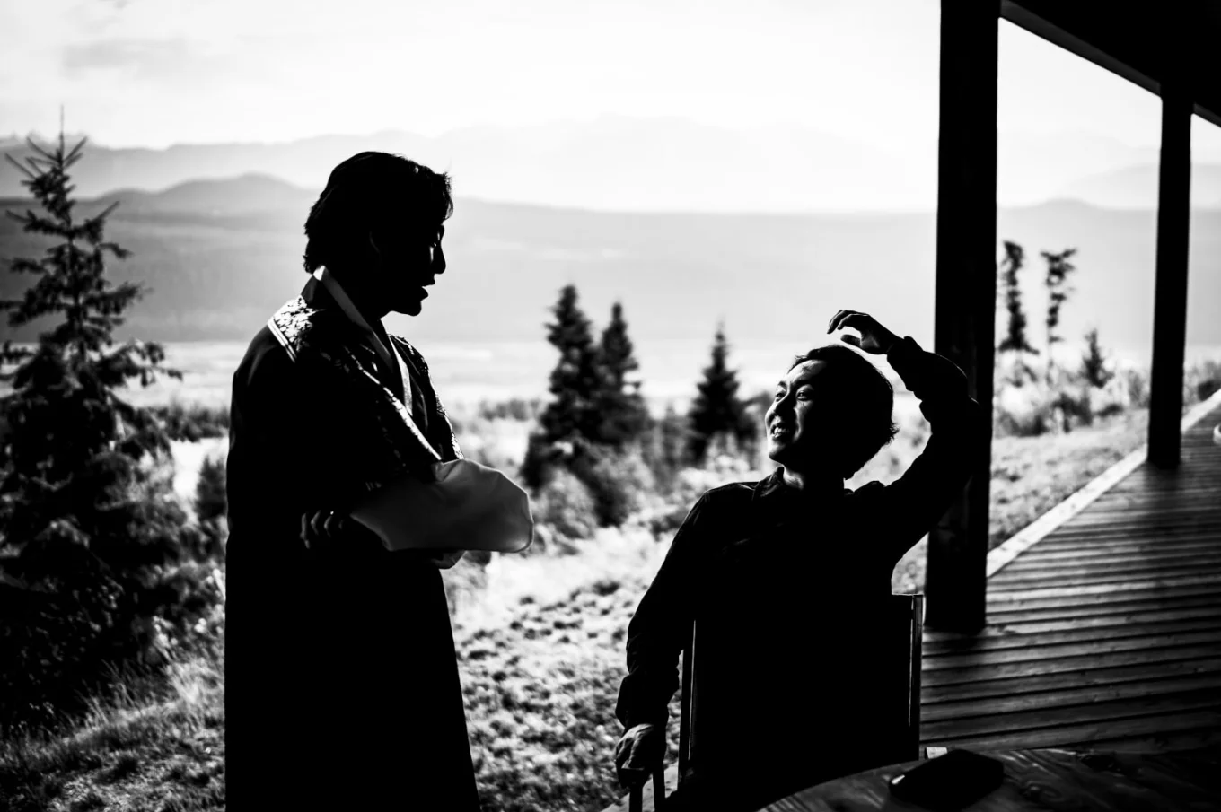 silhouetted talking to each other outside the Banff Wedding Reception.