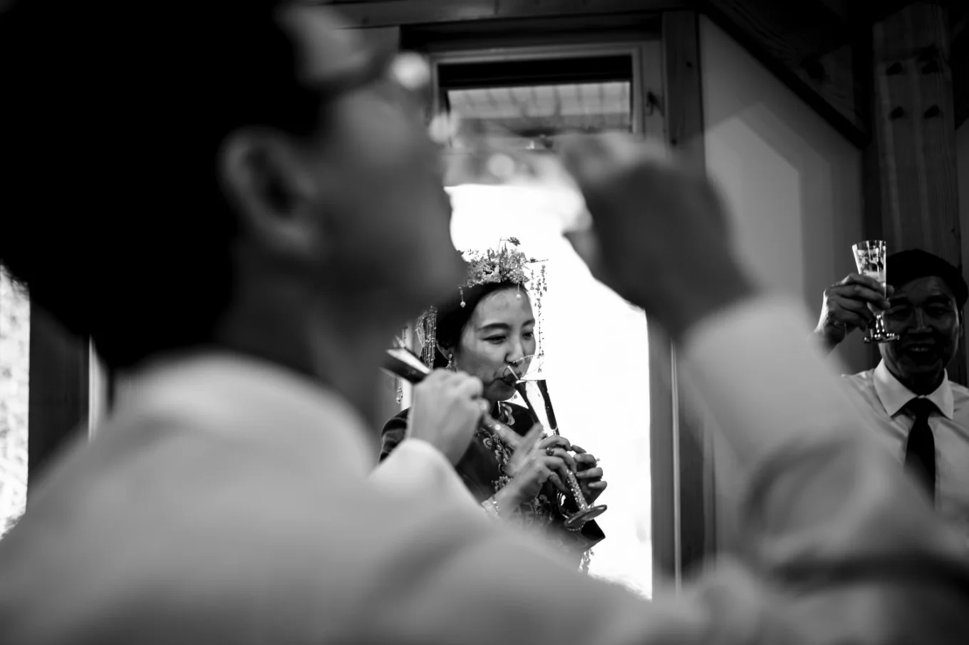 Shoot through the hand of drinking father of the bride durng Banff Wedding Reception.