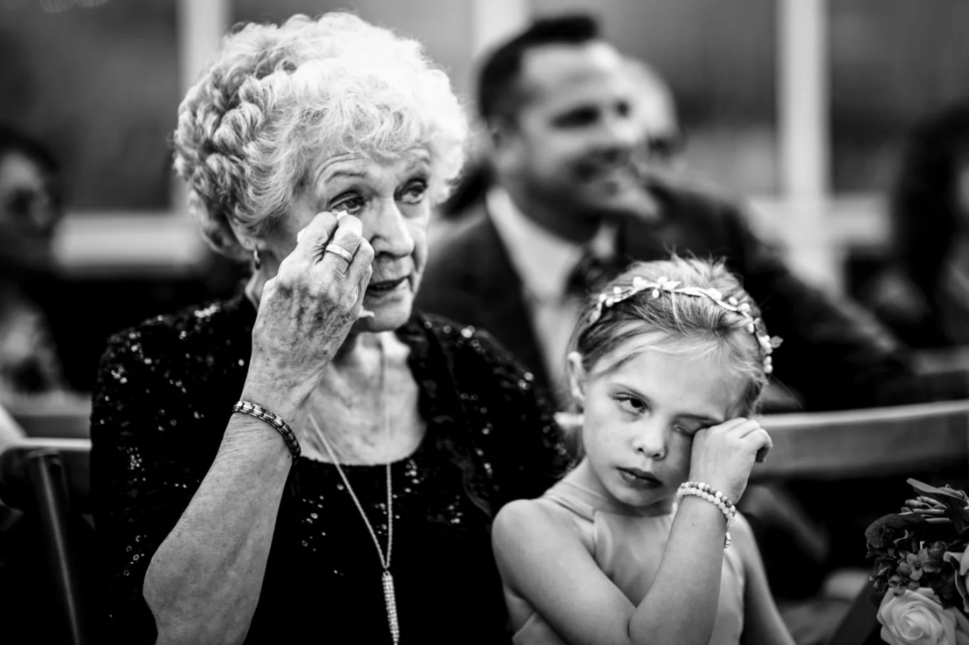 Mather and granddaughter cry during wedding ceremony.