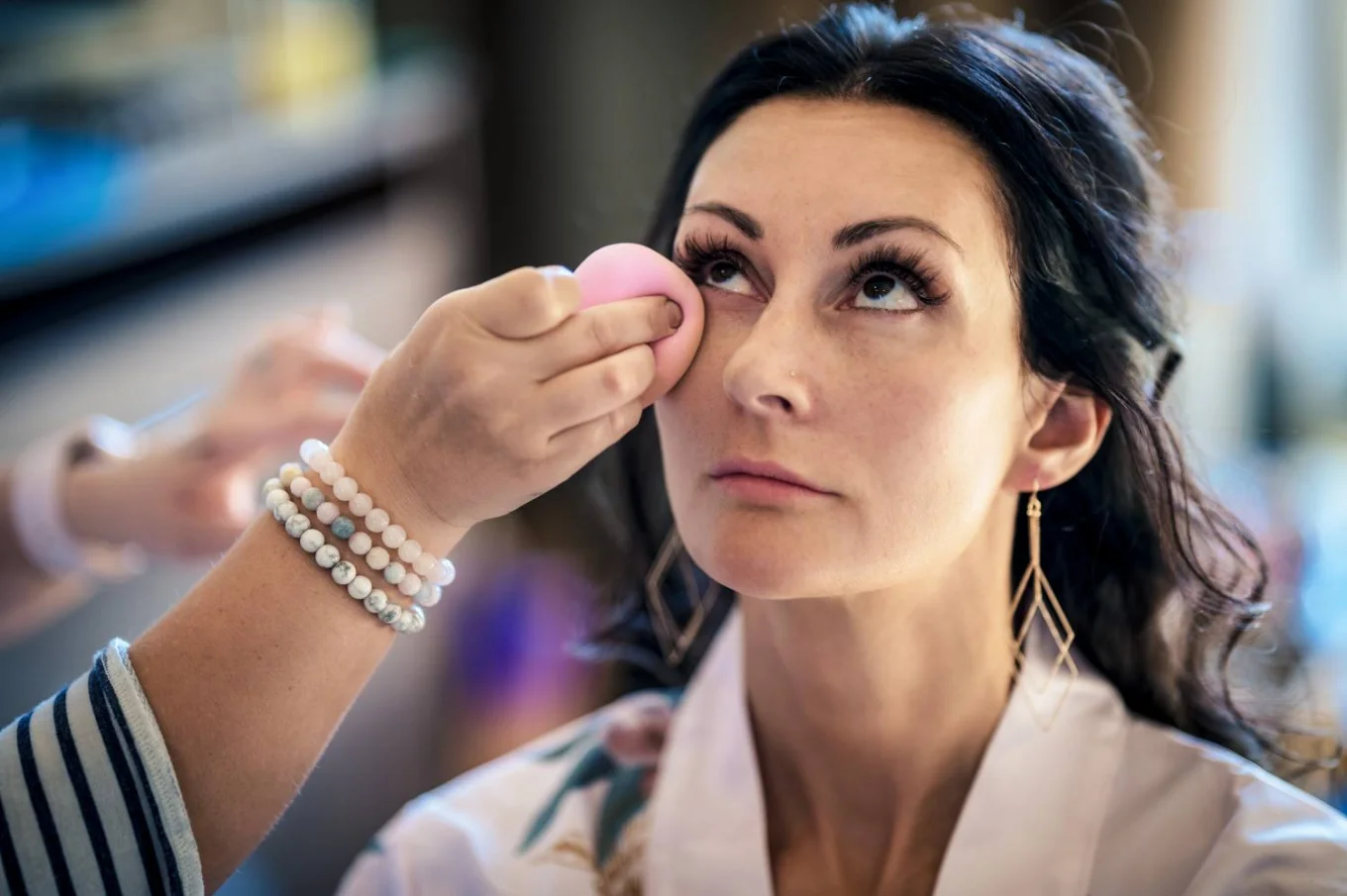 Bridesmaid getting her make up done before Calgary Wedding ceremony