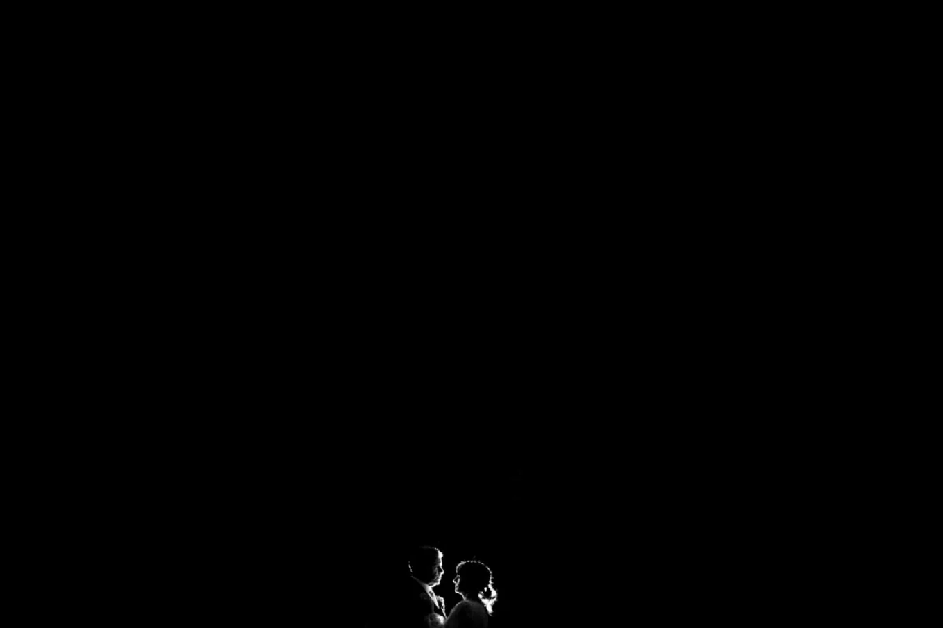 Back-lighted couple in black and white.