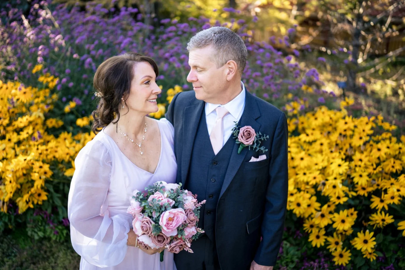 Newlyweds share romantic kiss.