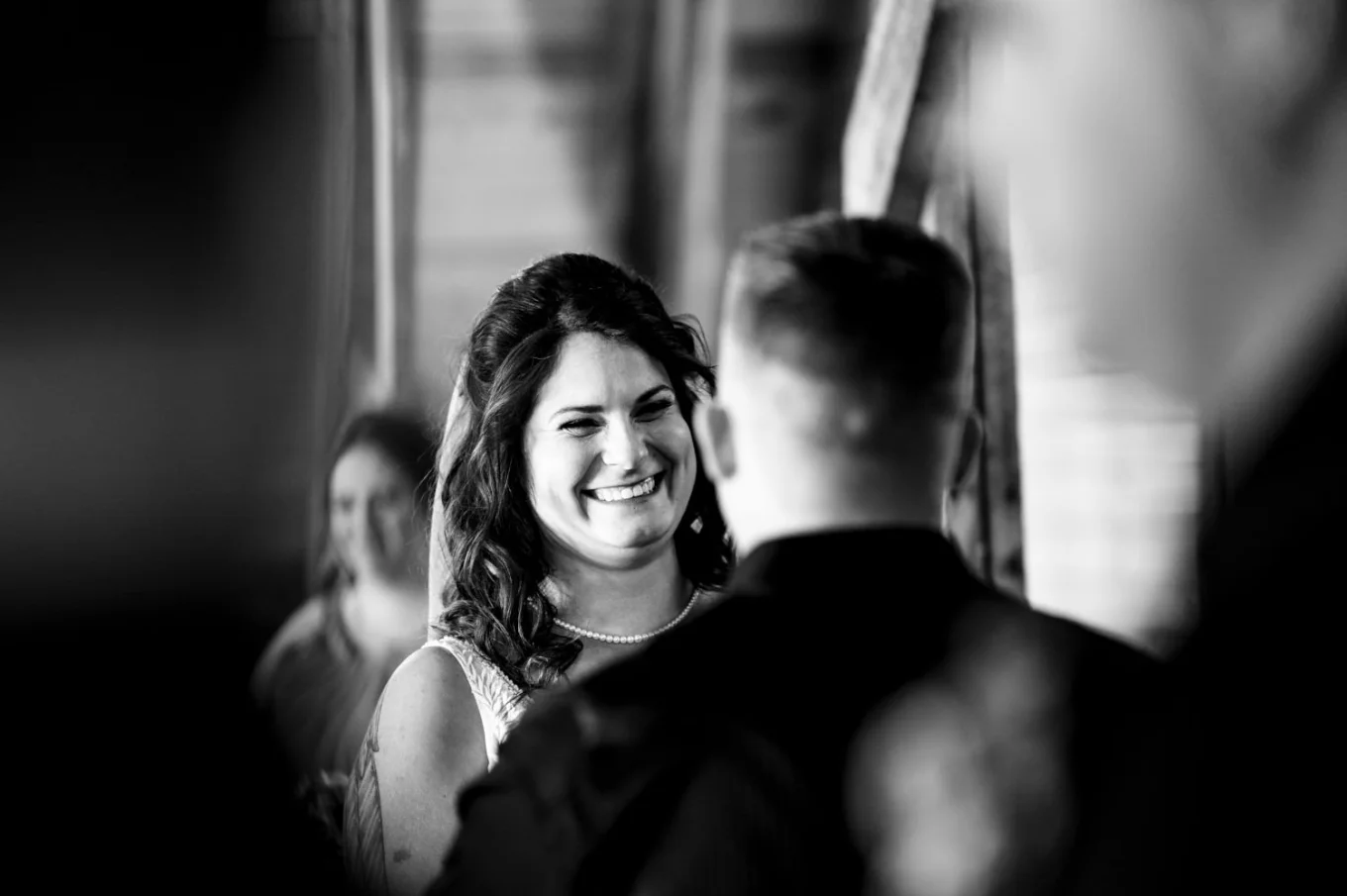 Bride looks and the groom at their Calgary