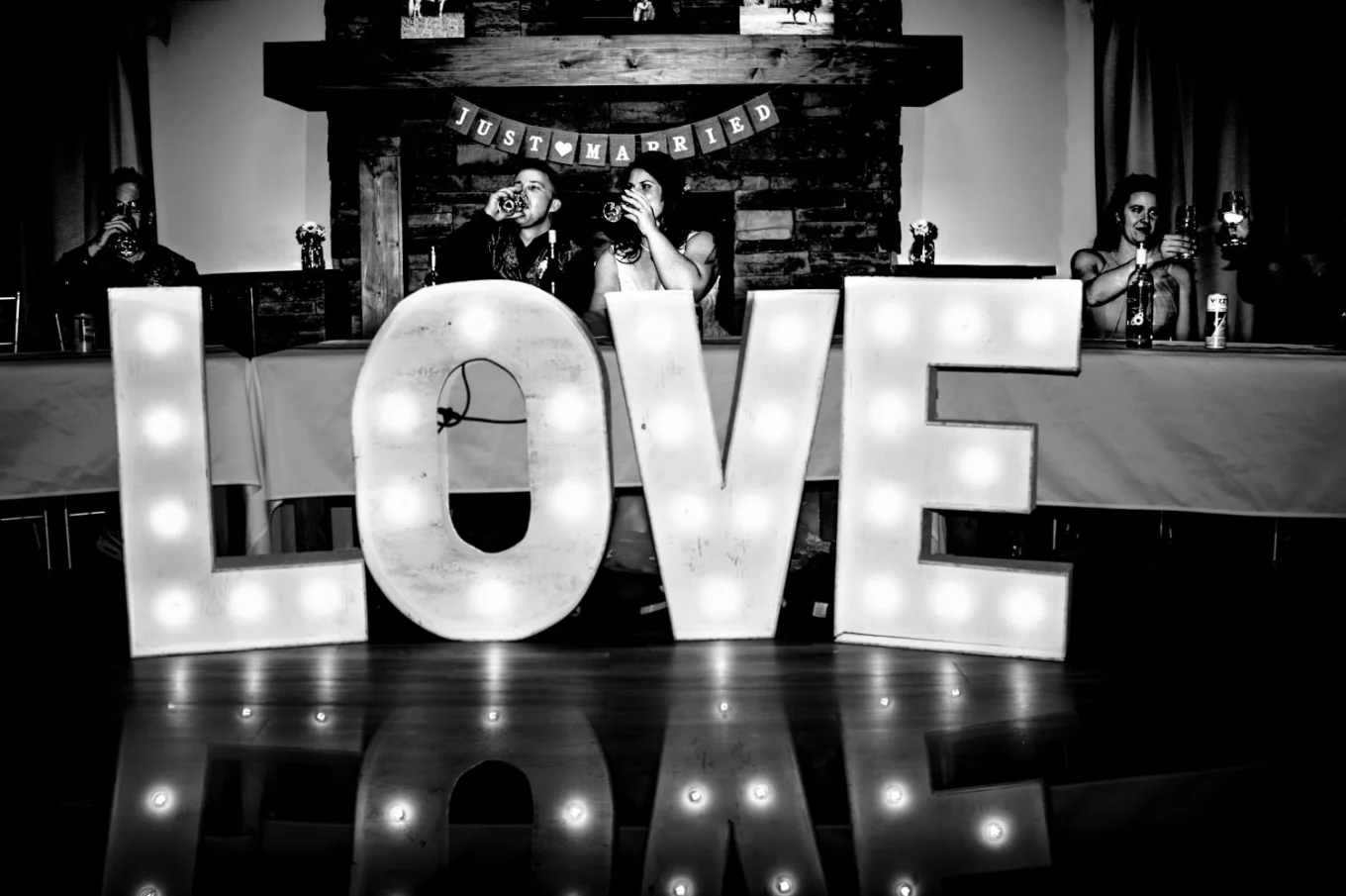 Giant love sigh in front of the newlyweds table.