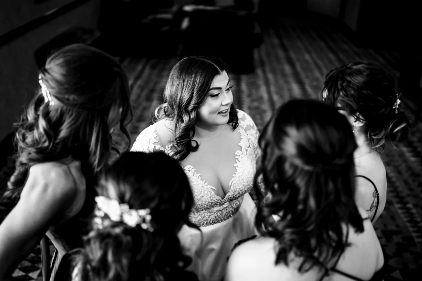 Moment of the bride and her sisters talking captured by best Banff Wedding Photographer.