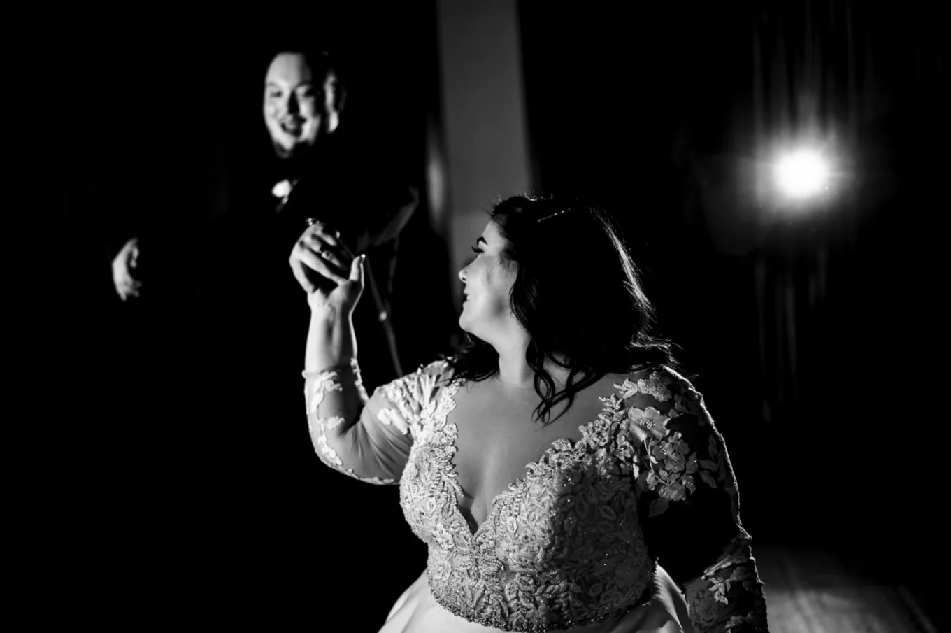 First dance of the bride and groom during Banff Wedding Reception. Bride look at the groom while he smiles to her.