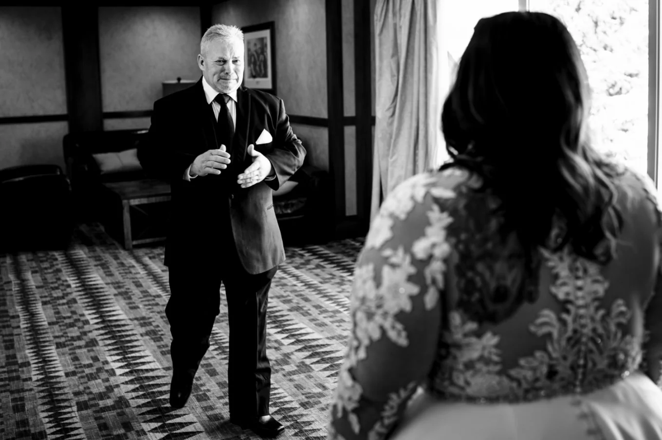 Father of the bride walks towards to hug the bride - first look - father and bride.