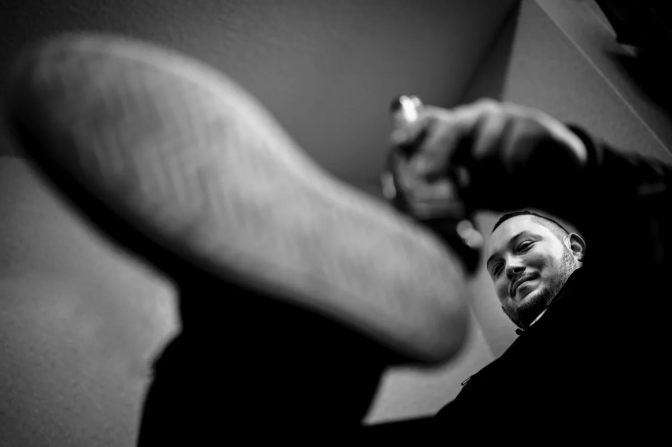shoot through the hand and leg of the groom drinking beer